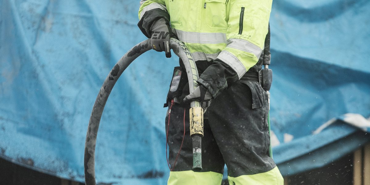Restoration technician in PPE on a Houston water damage job